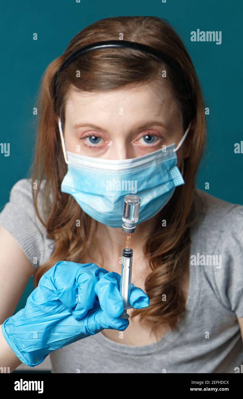 Mask woman vial syringe hi-res stock photography and images - Alamy