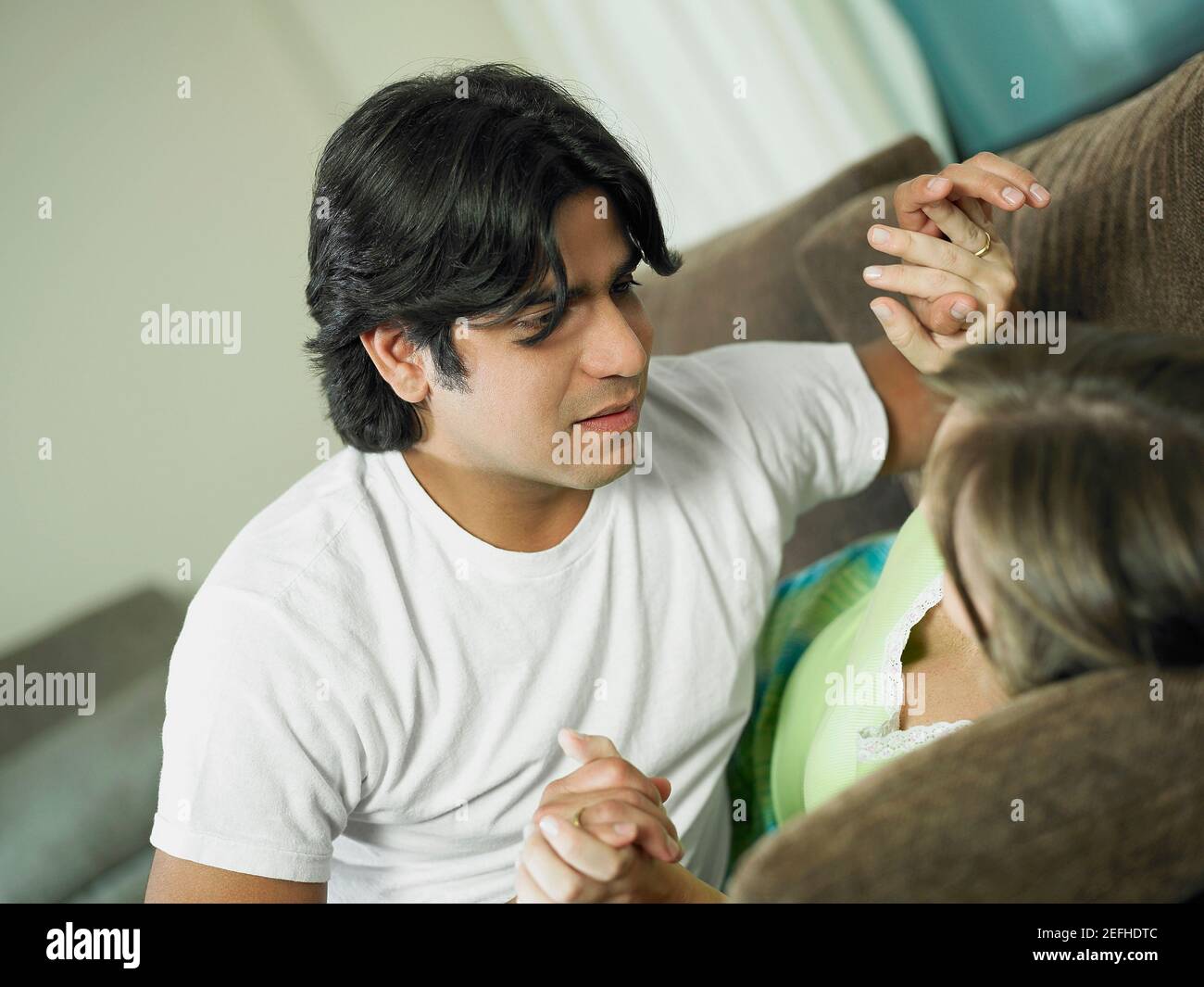 young-hispanic-woman-clasp-hands-hi-res-stock-photography-and-images