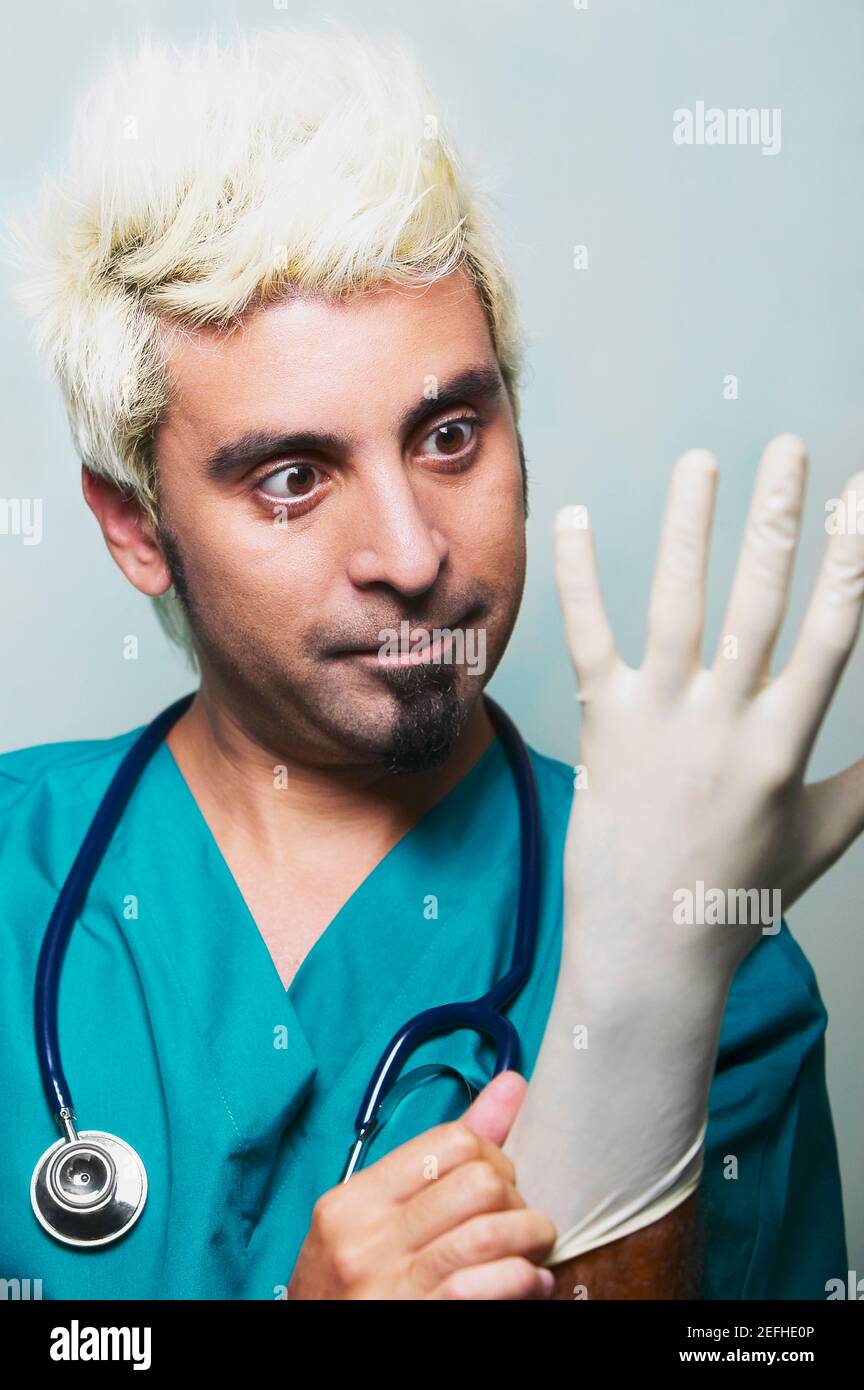 Close up of a surgeon wearing surgical gloves Stock Photo Alamy