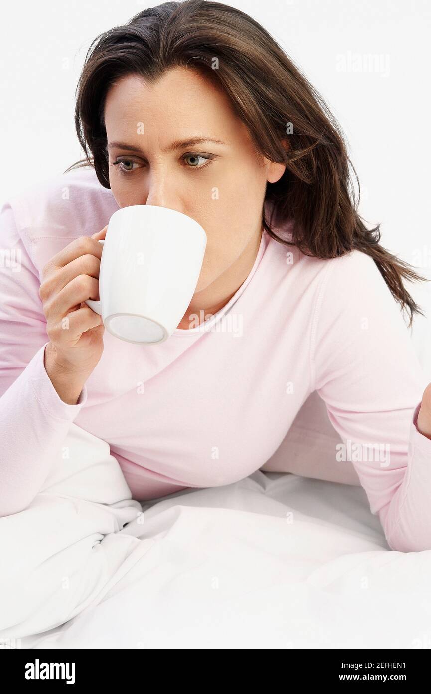 Mature woman drinking cup of coffee Stock Photo
