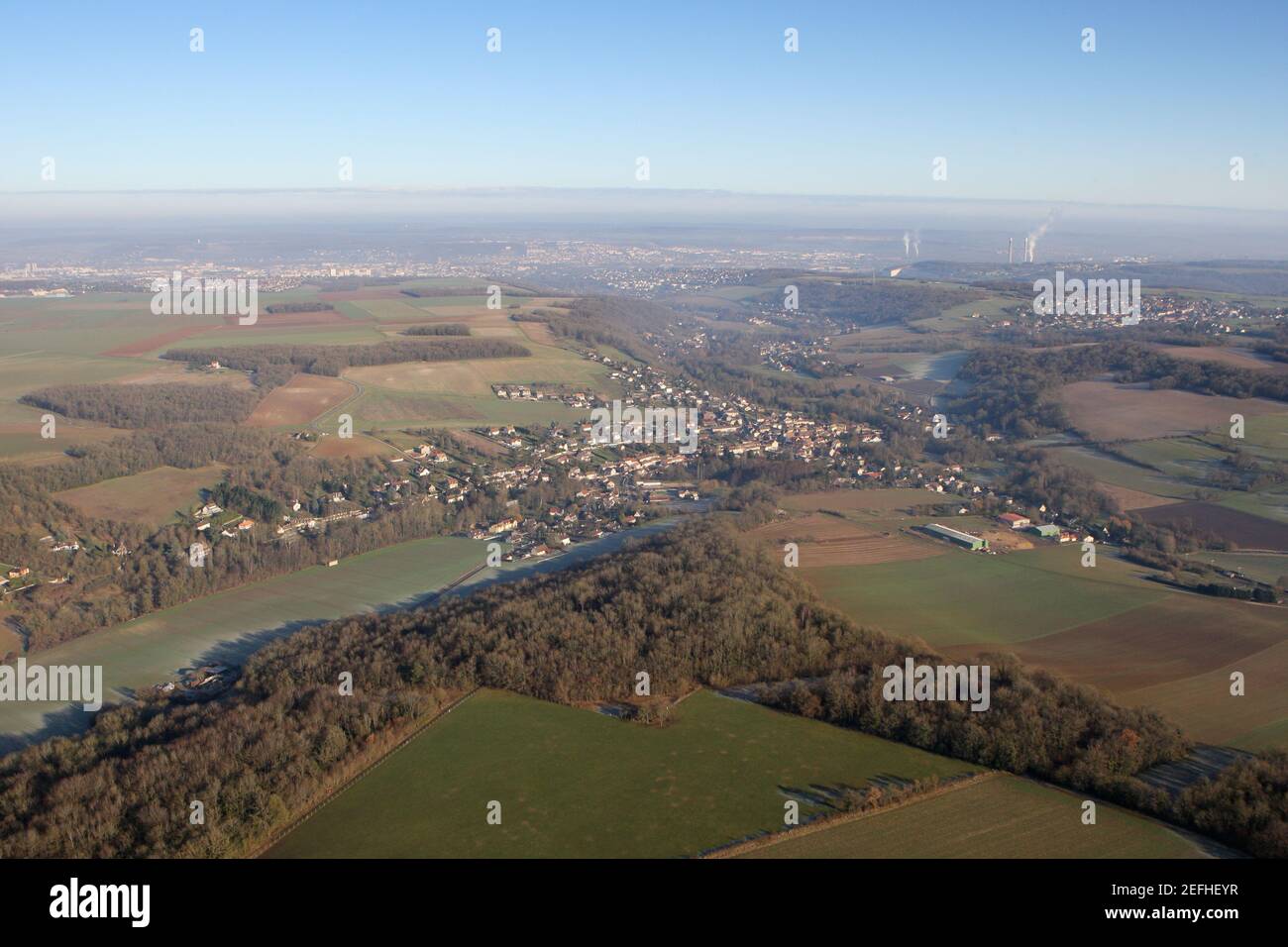 Aerial view of the commune of Vert and the valley of the Seine on the horizon, in the Yvelines department (78930), Ile-de-France region, France - Janu Stock Photo