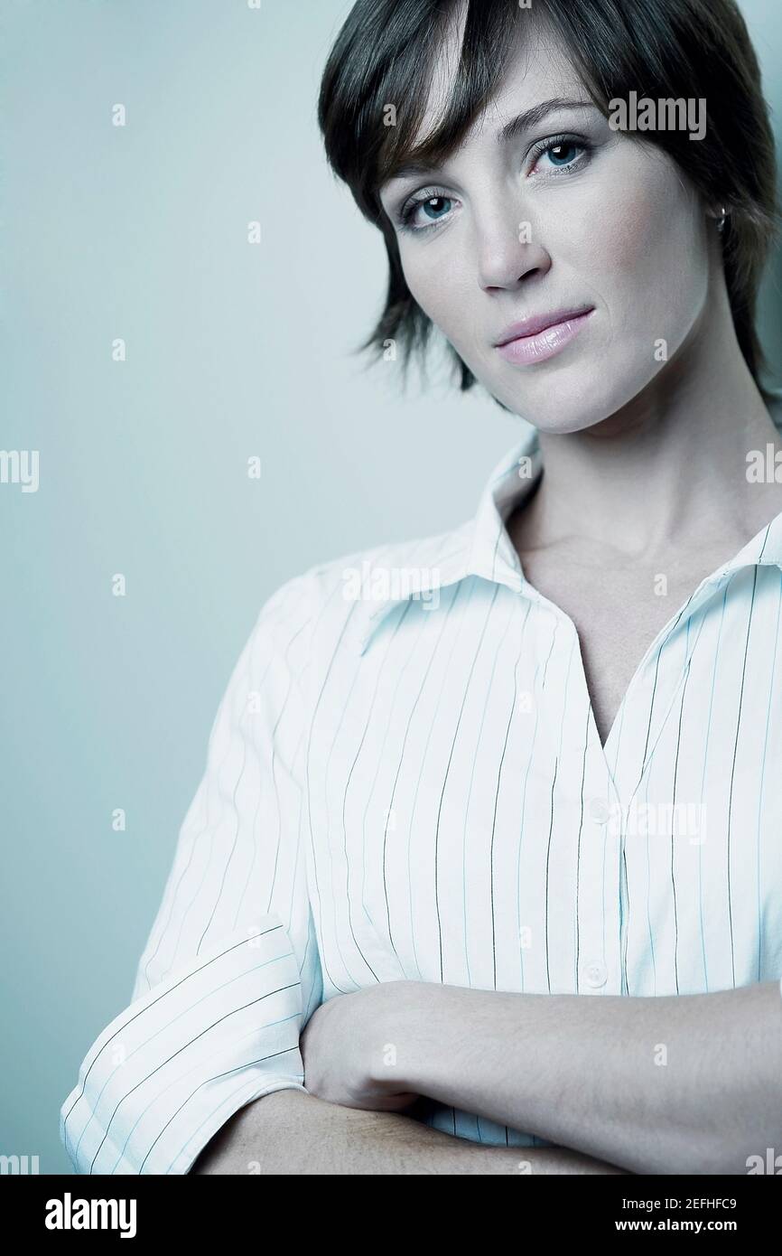 Woman smiling with her arms crossed hi-res stock photography and images ...