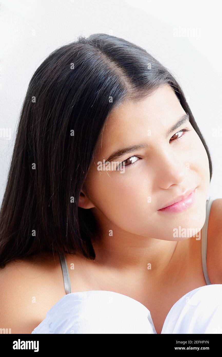 Portrait of a girl hugging her knees Stock Photo