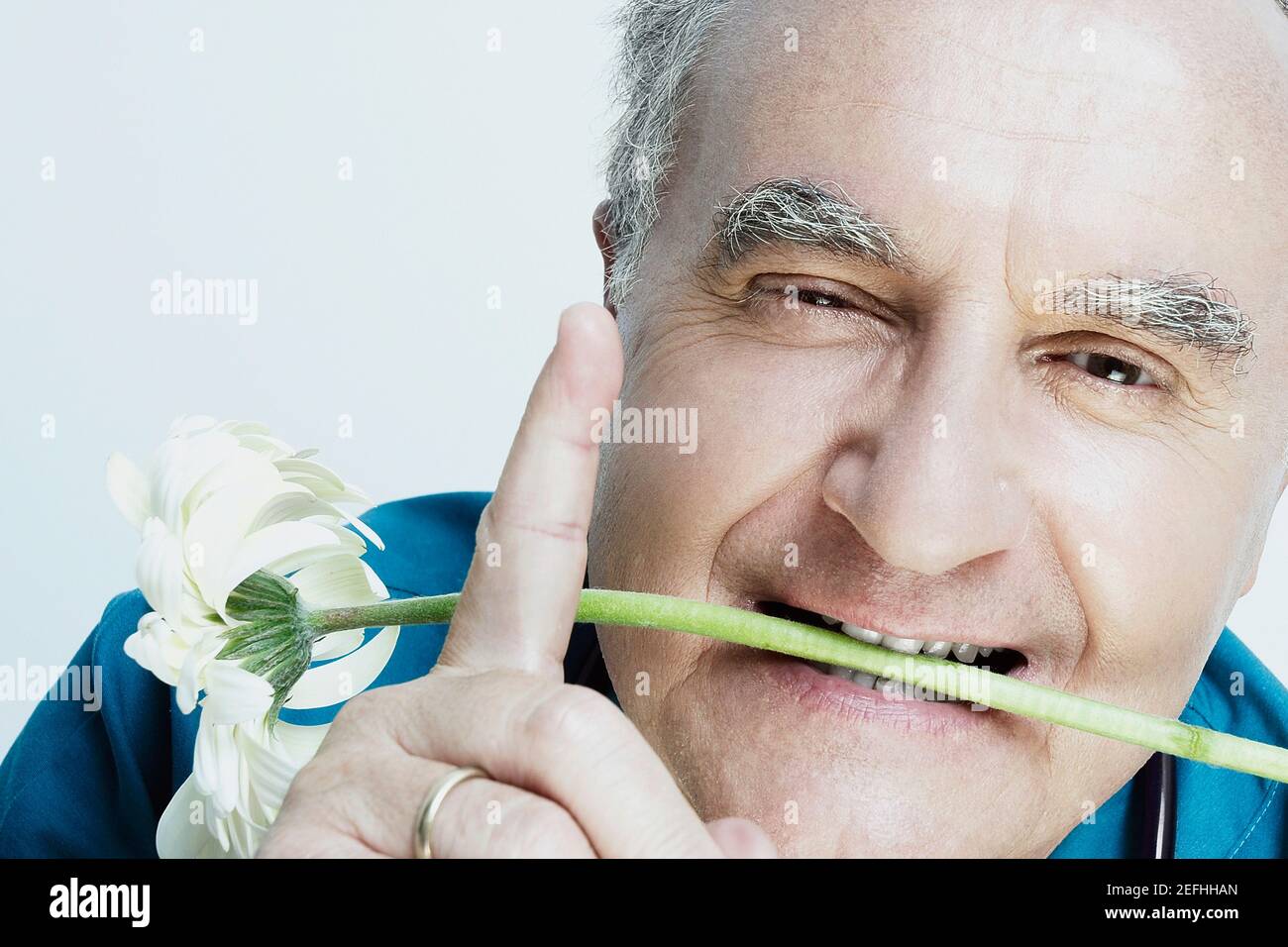 Old man pointing mouth hi-res stock photography and images - Alamy