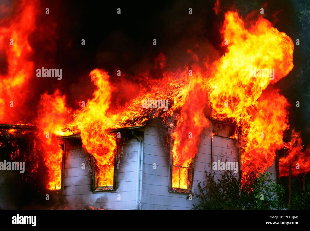 Flames emitting out of a burning house, Montgomery County, Maryland, USA Stock Photo