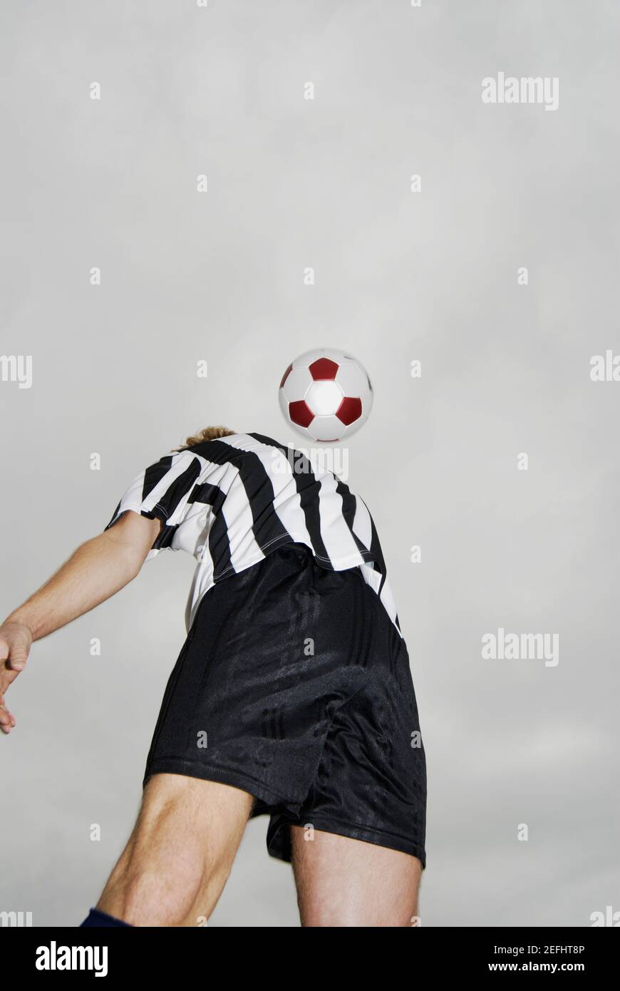 Low angle view of a soccer player heading a soccer ball Stock Photo Alamy