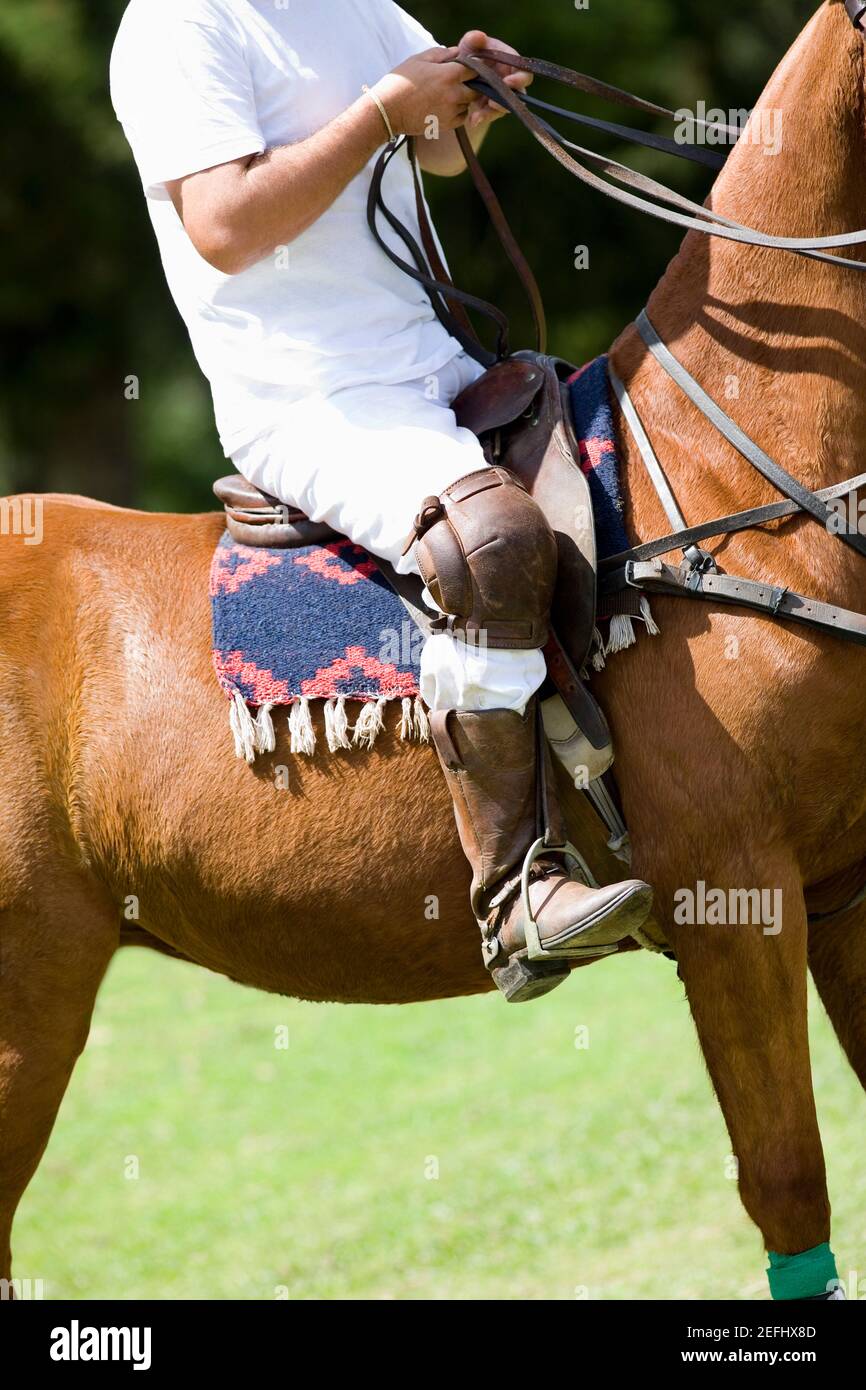 Low section view of a man riding a horse Stock Photo - Alamy