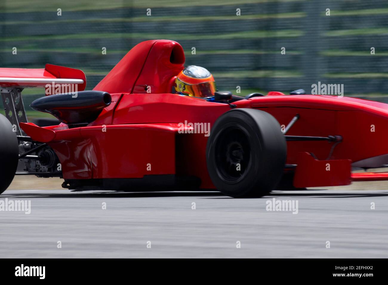 Person driving a formula one racing car on a motor racing track Stock Photo Alamy