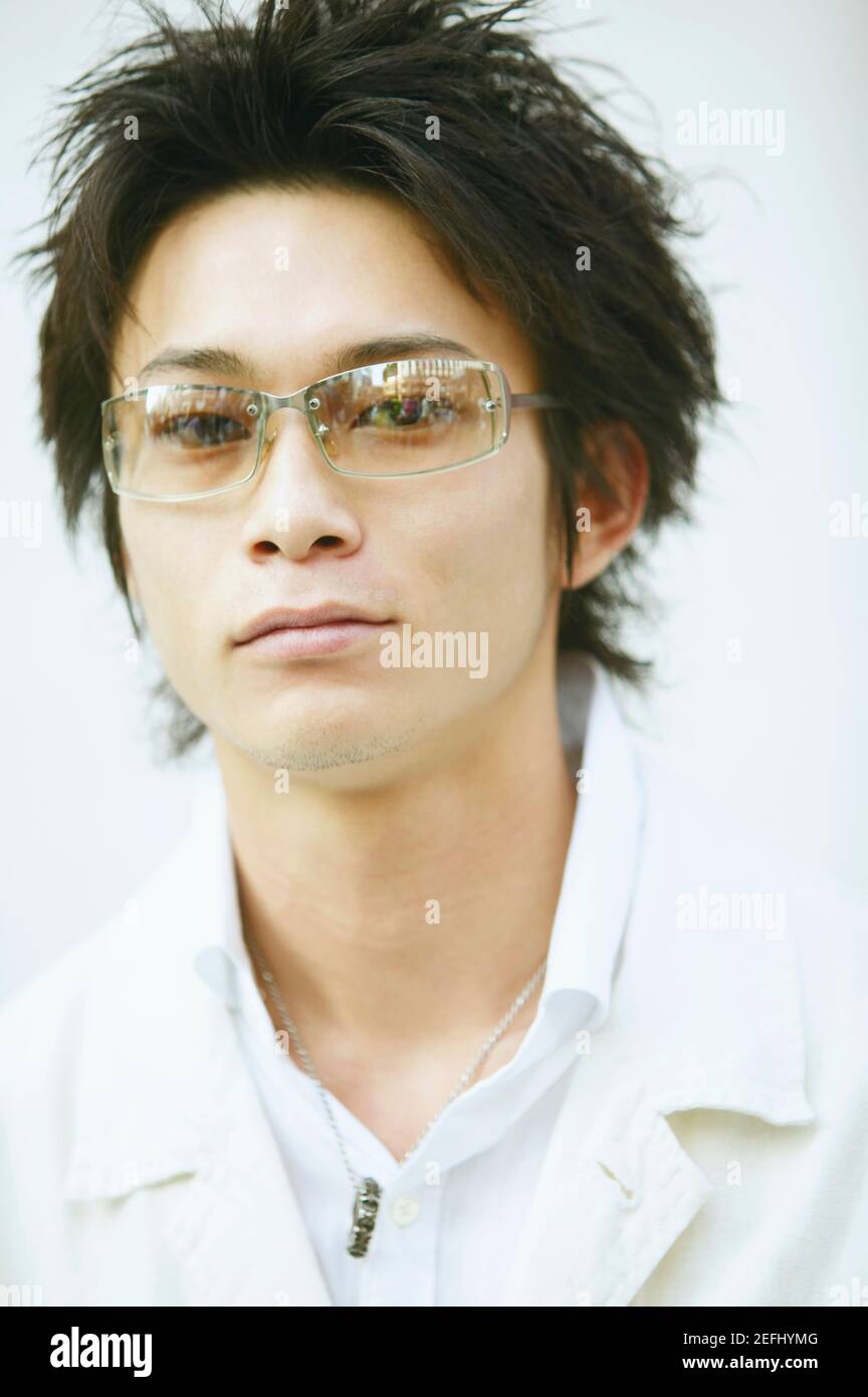 Portrait of a young man wearing sunglasses Stock Photo - Alamy