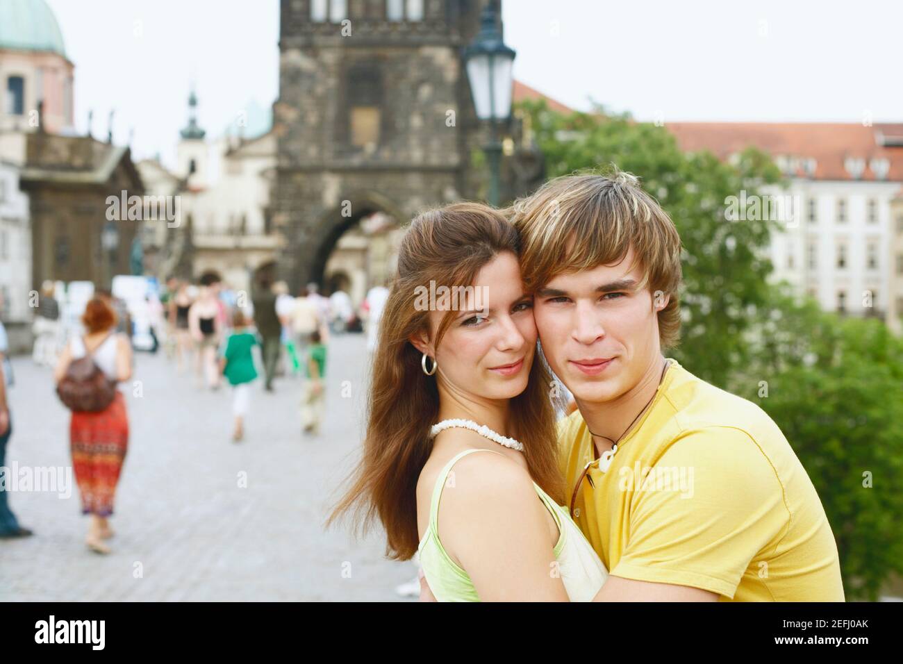 Side profile of a young man embracing a young woman Stock Photo - Alamy
