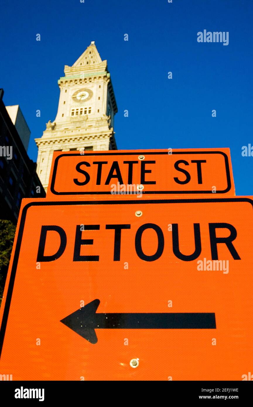 Sign board in front of a clock tower, Custom House, Boston ...