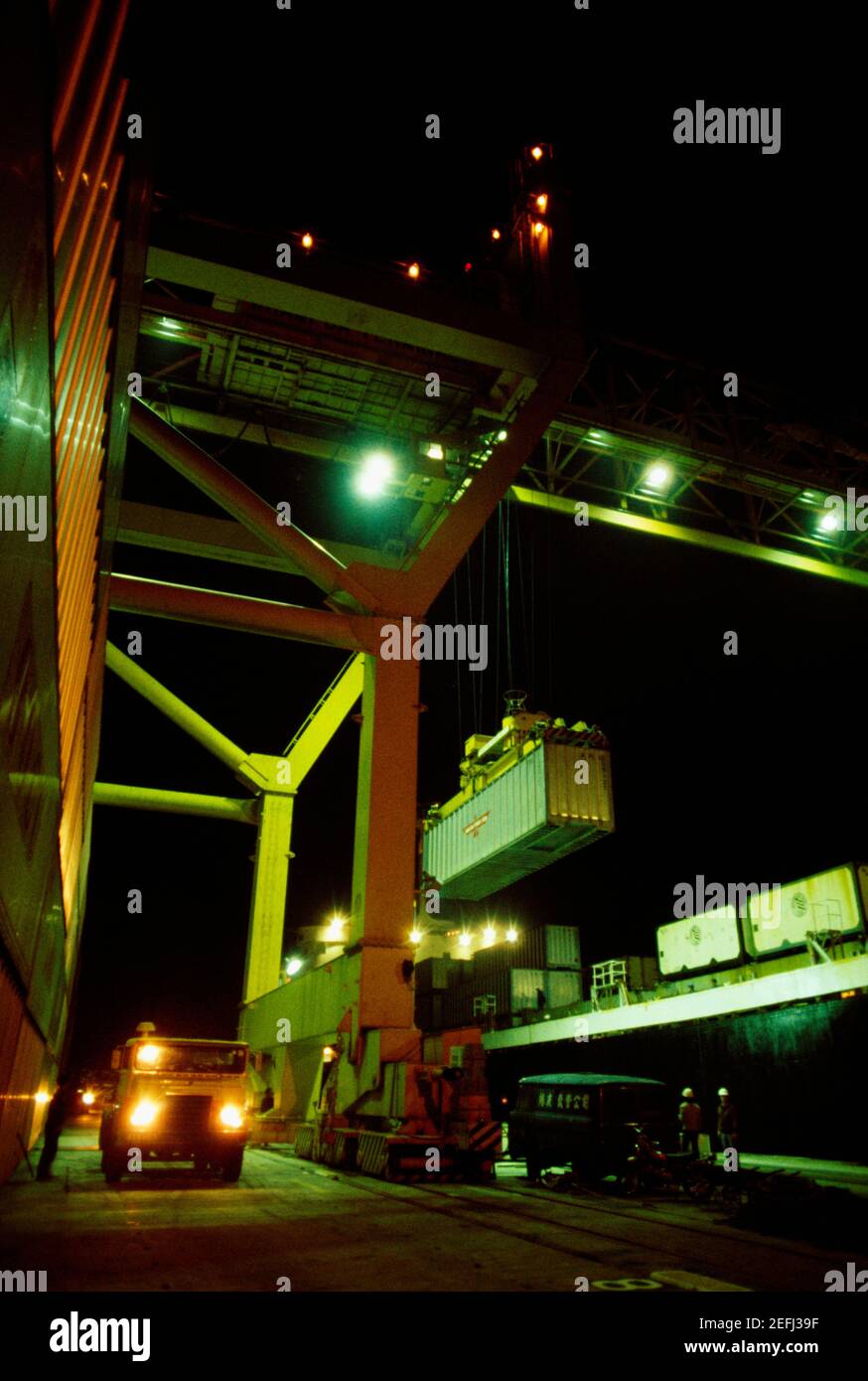 Crane lifting a container at marine terminal, Hong Kong, China Stock ...
