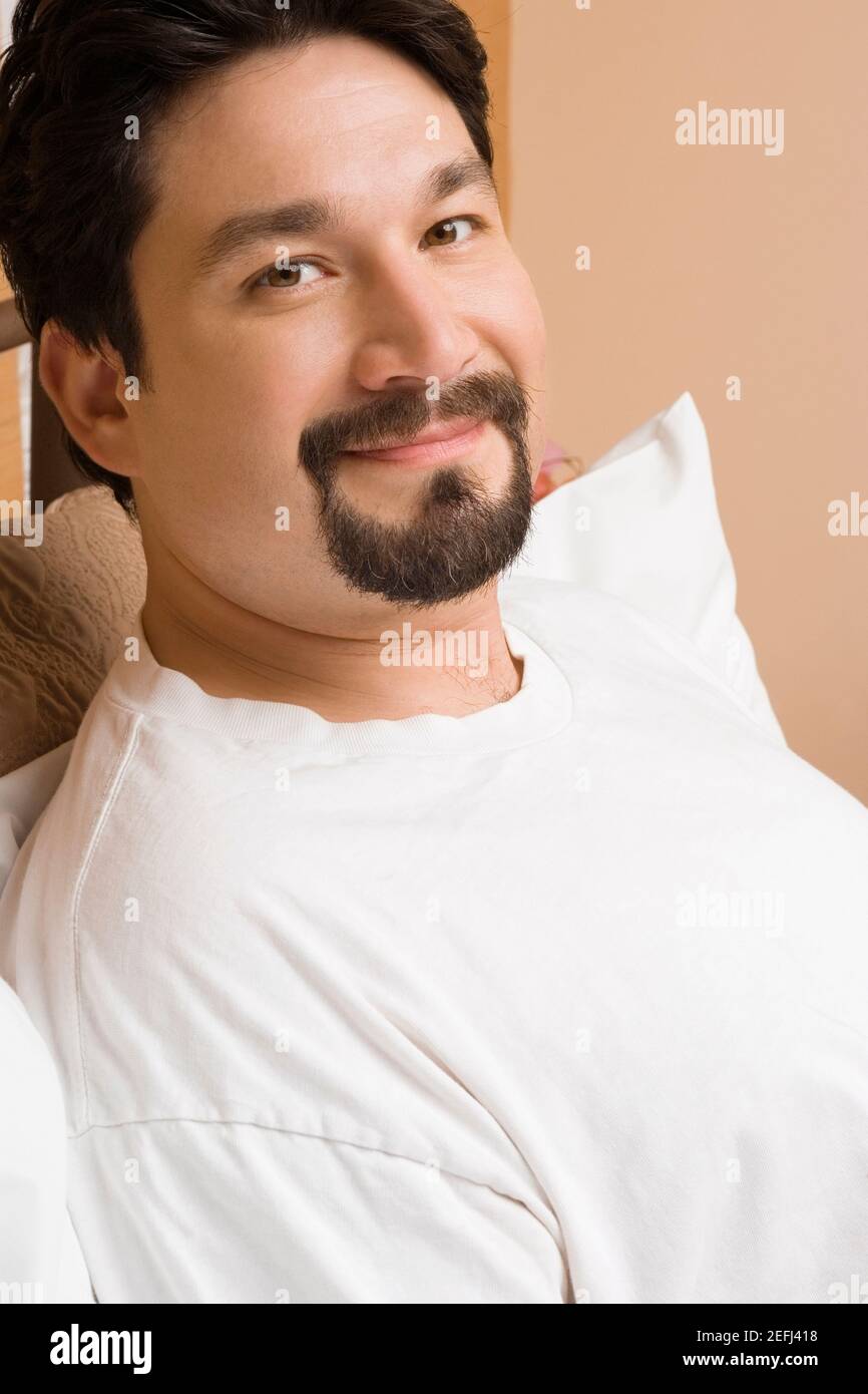 Mid adult man reclining hi-res stock photography and images - Alamy