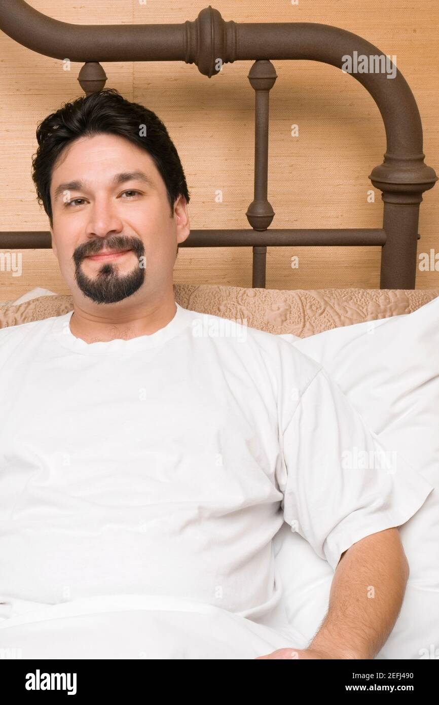Positive black man reclining hi-res stock photography and images - Alamy