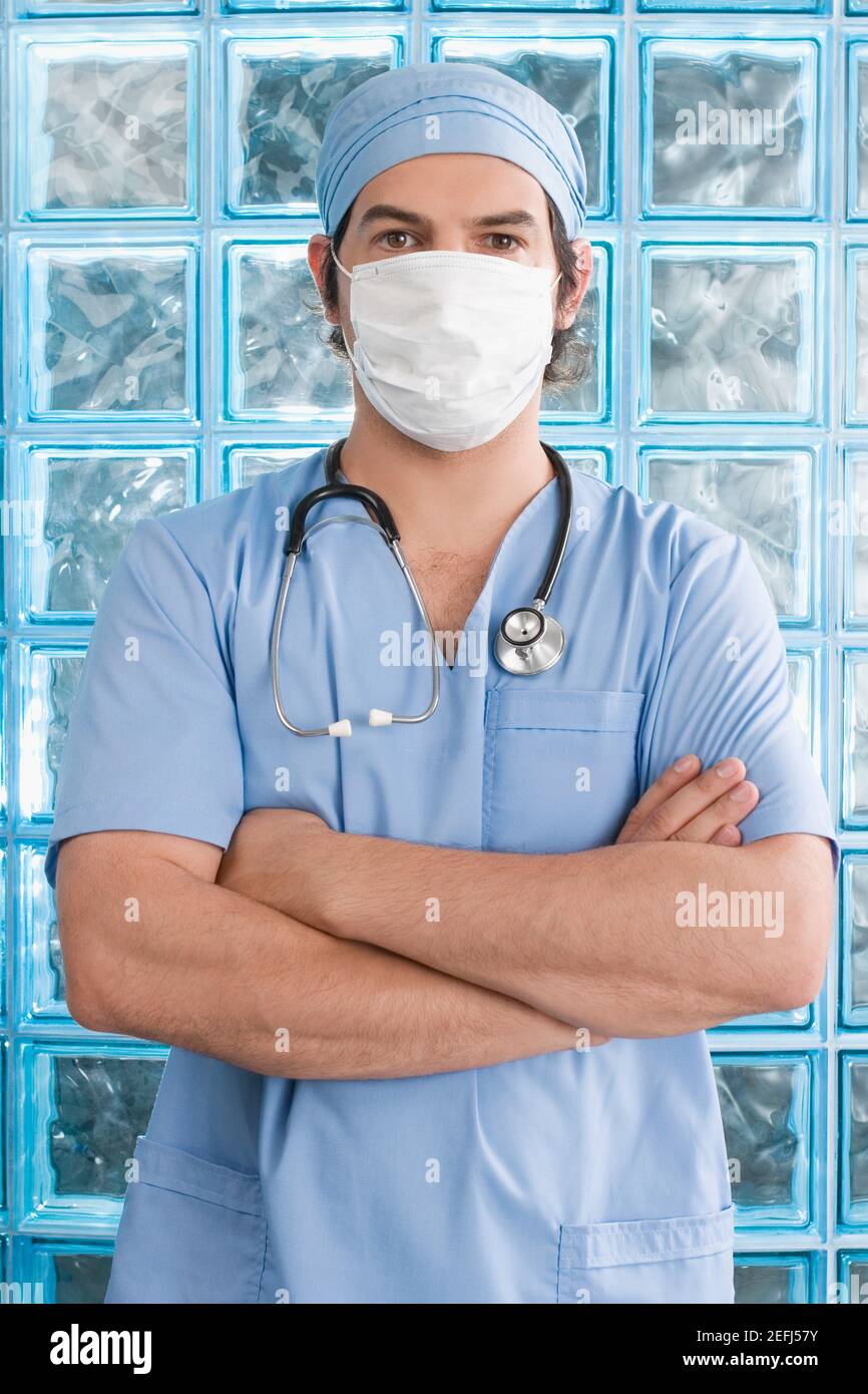 Male surgeon wearing a surgical mask Stock Photo