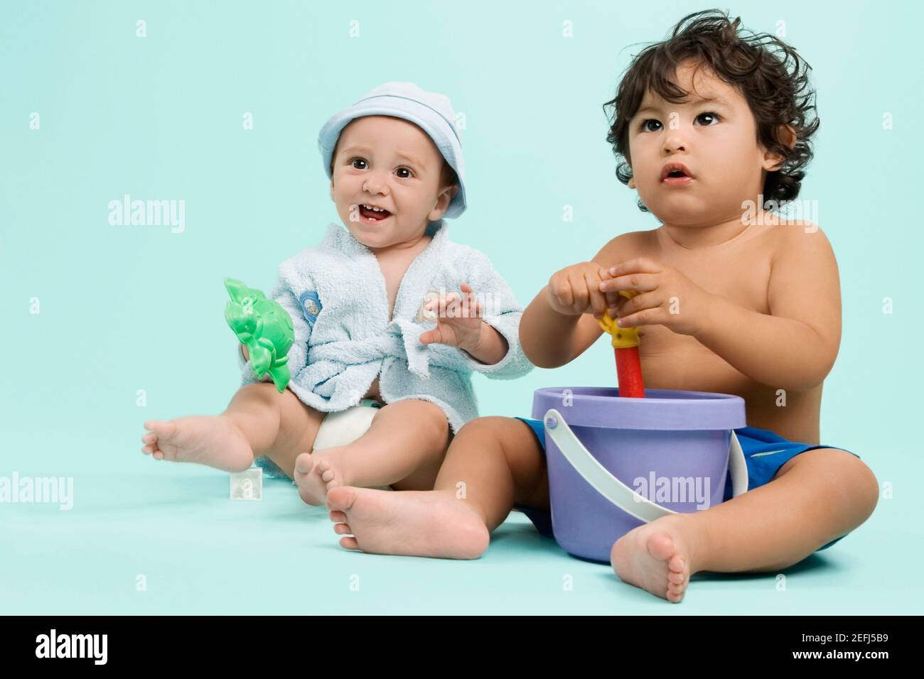 Two children playing with toys Stock Photo - Alamy