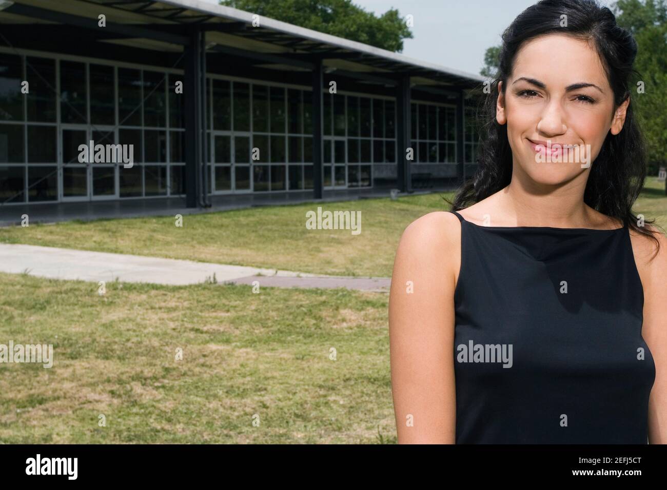 Portrait of a female university student smiling Stock Photo - Alamy