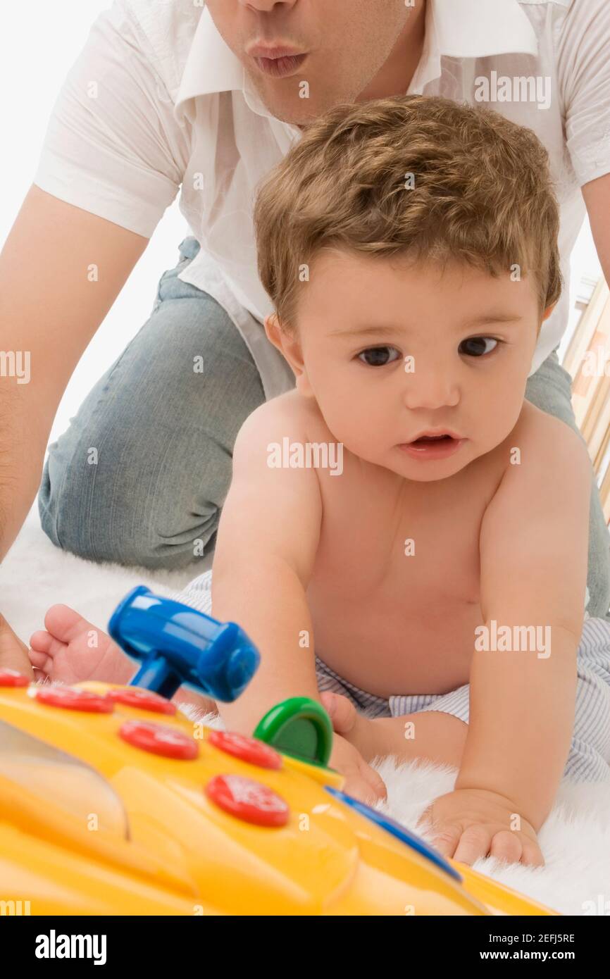 Close up of a young man playing with his son Stock Photo