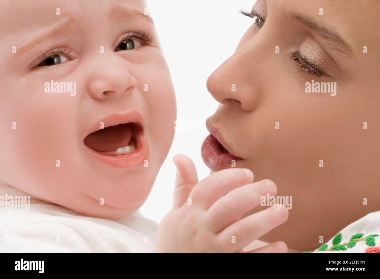Close up of a mid adult woman looking at her son Stock Photo