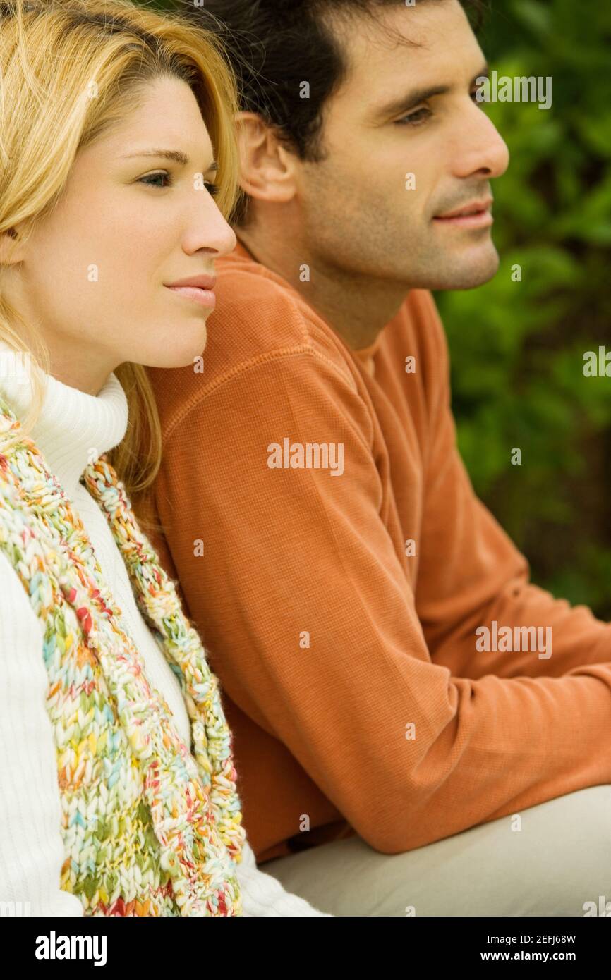 Side profile of a young woman sitting with a mid adult woman Stock ...