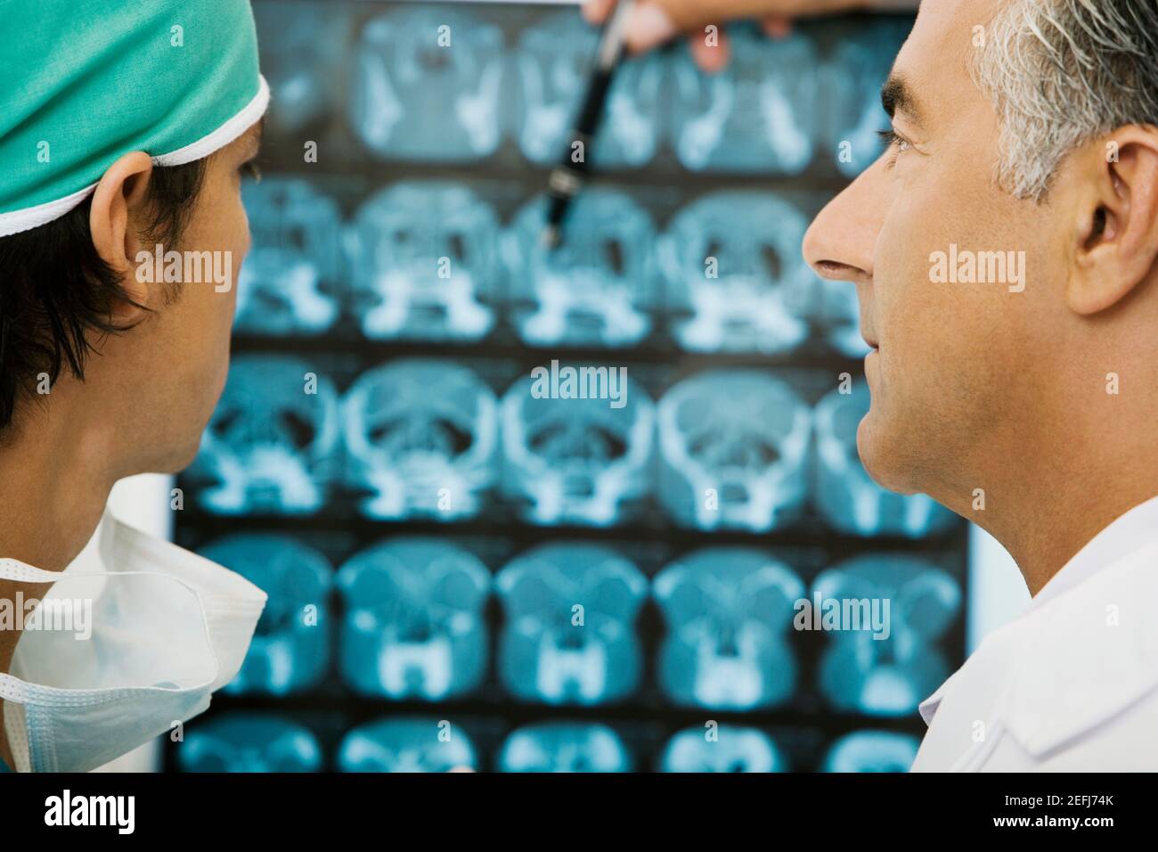 Two male doctors examining an X-Ray Stock Photo - Alamy
