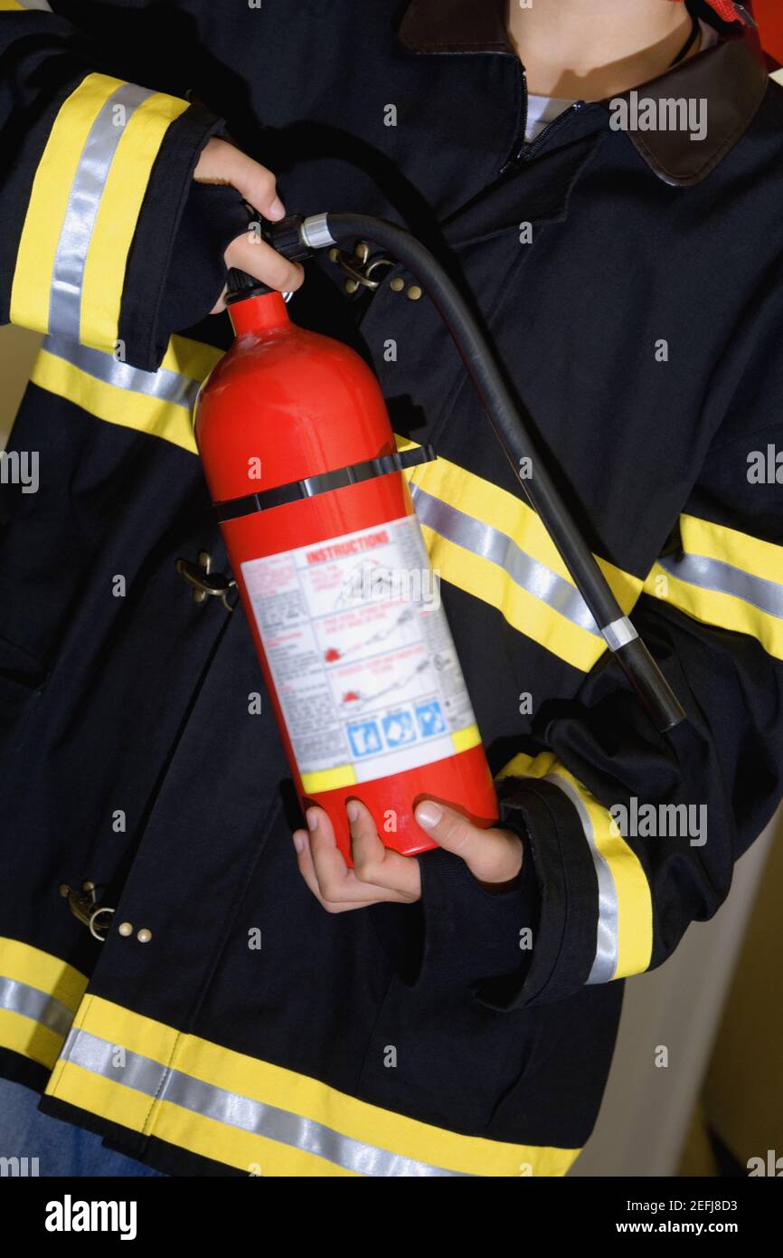 Children fire extinguisher immagini e fotografie stock ad alta