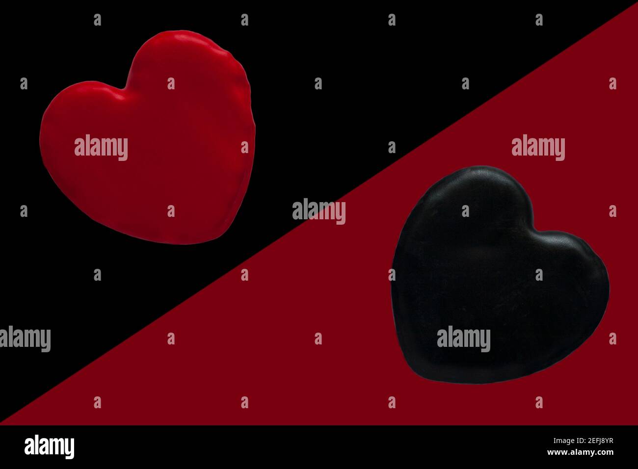 red heart on black background and black heart on red background abstract background 2 hearts - concept of two sides of love, love and dark love Stock Photo