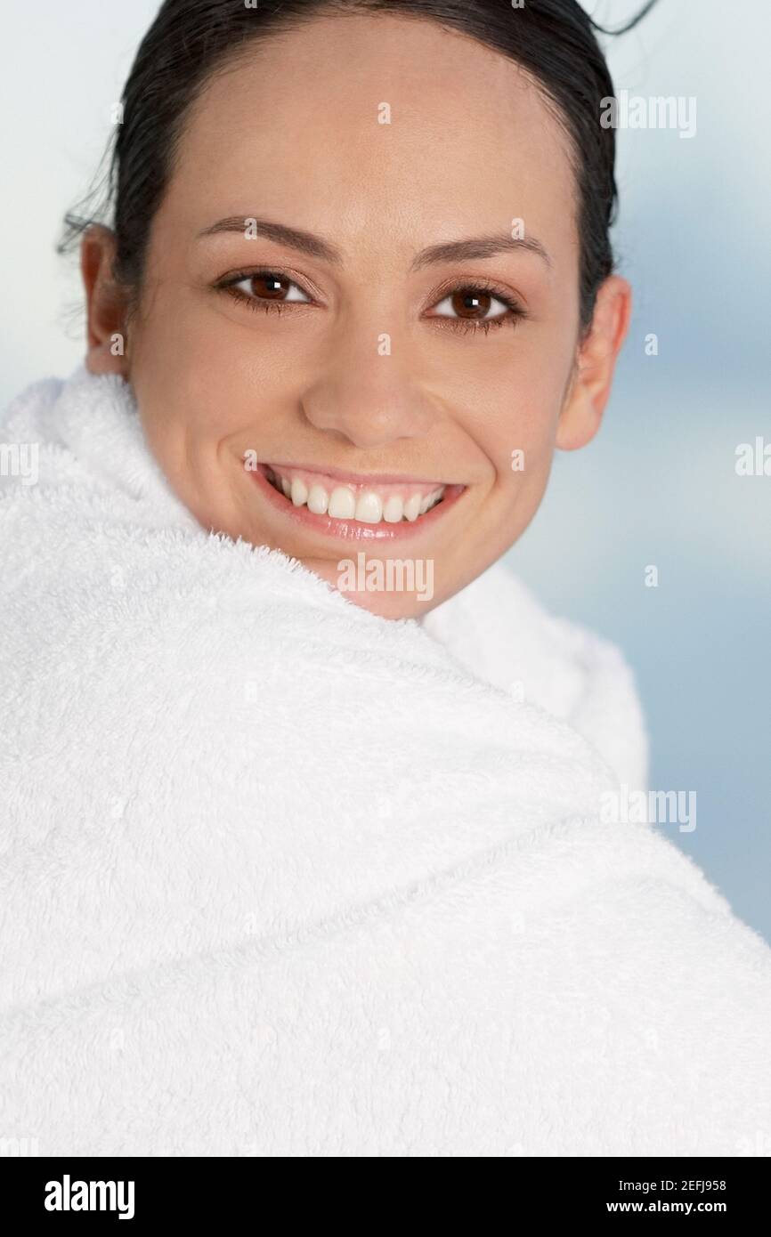 Portrait of a young woman wrapped in a towel Stock Photo - Alamy