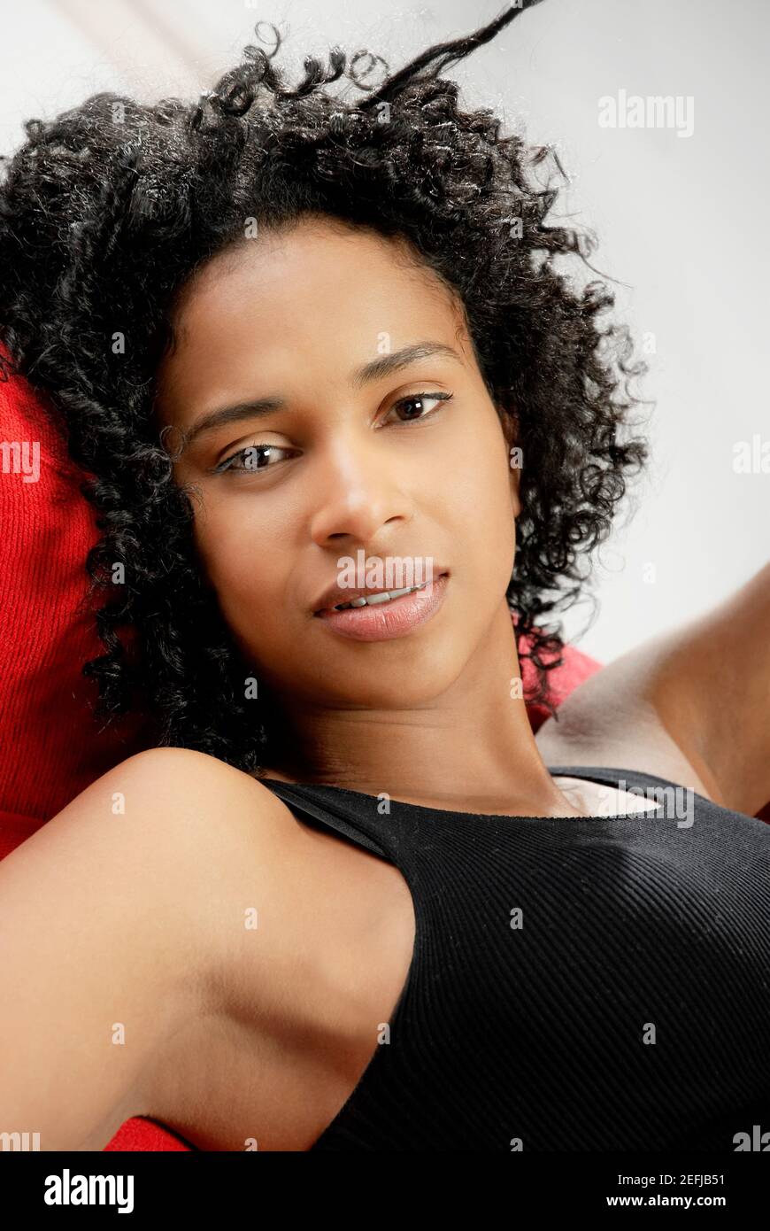 Portrait of a young woman reclining Stock Photo Alamy