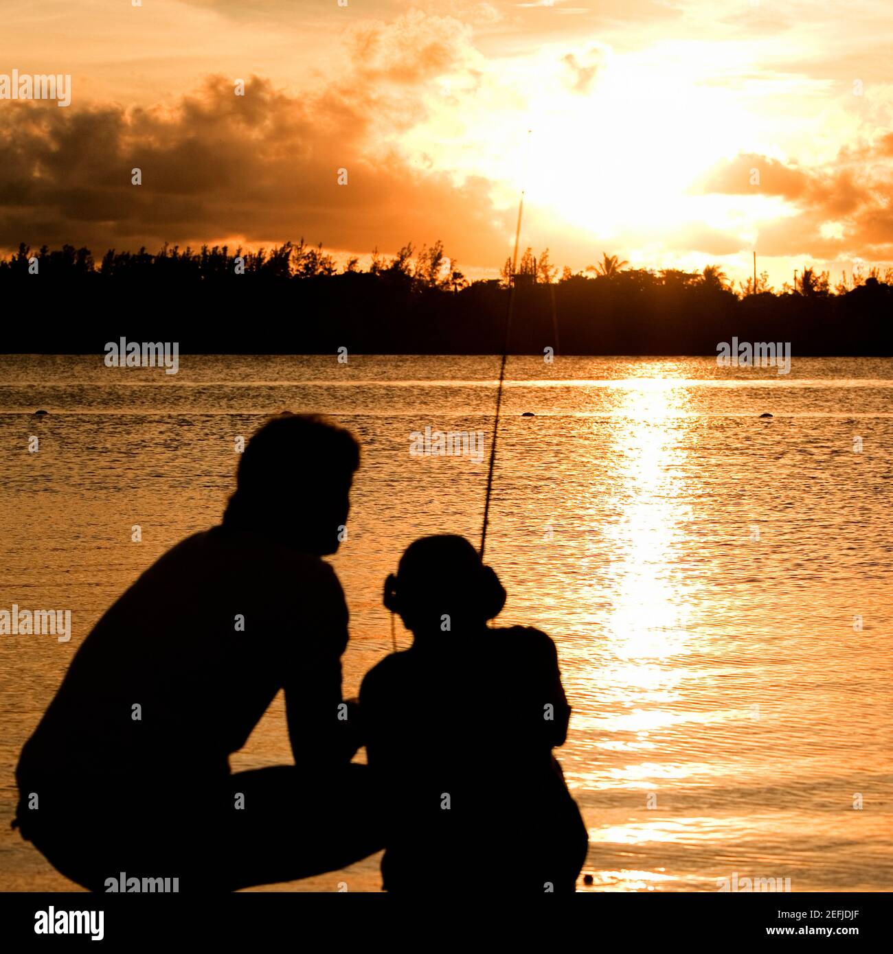 Father son silhouette fishing sunset hi-res stock photography and ...