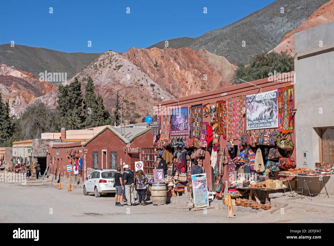 Street with souvenir shops in the village Purmamarca at the foot of Cerro de los Siete Colores, Quebrada de Purmamarca, Jujuy Province, Argentina Stock Photo