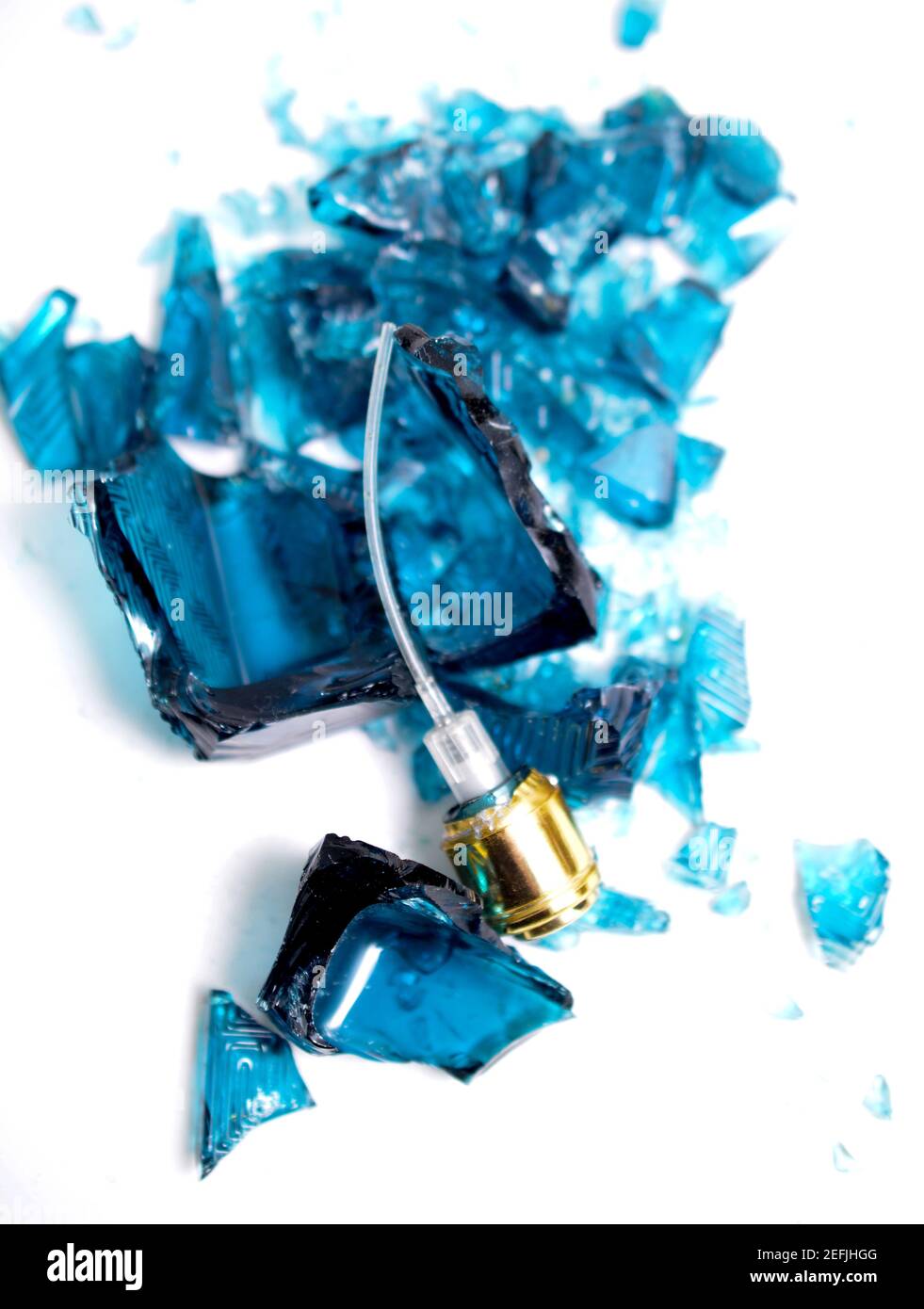Broken perfume bottle on white background Stock Photo Alamy