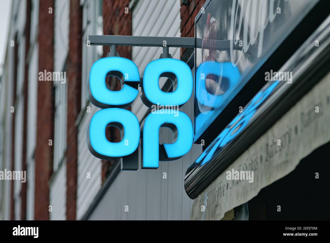 Close up of the blue logo of the COOP supermarket chain, England UK