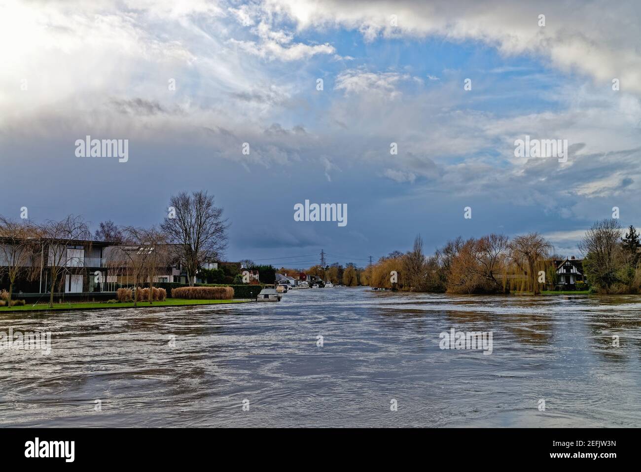 The River Thames in full flood after heavy rainfall, Shepperton lock Surrey England UK Stock Photo