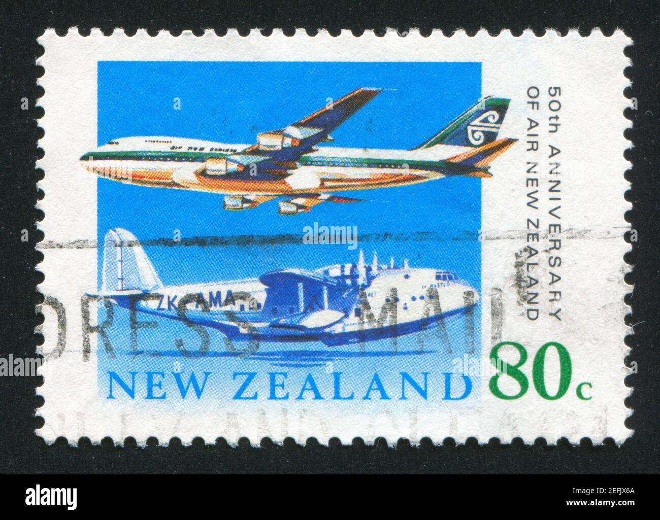 NEW ZEALAND - CIRCA 1990: stamp printed by New Zealand, shows Short S30 Empire Class Flying Boat, Boeing 747-200, circa 1990 Stock Photo