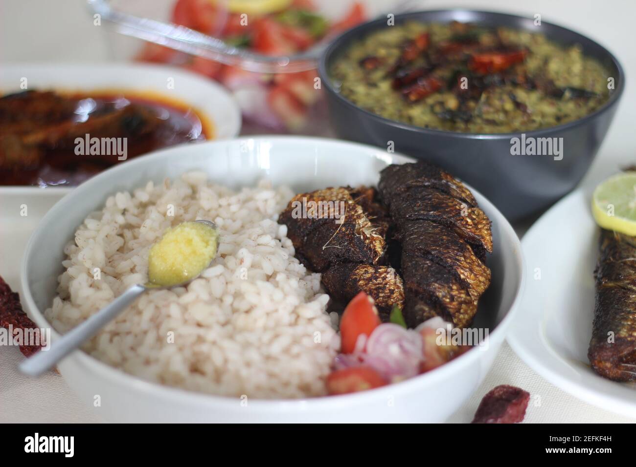 Sardis Rice Kerala meals with red rice, sardines curry, sardine fry and coconut ...