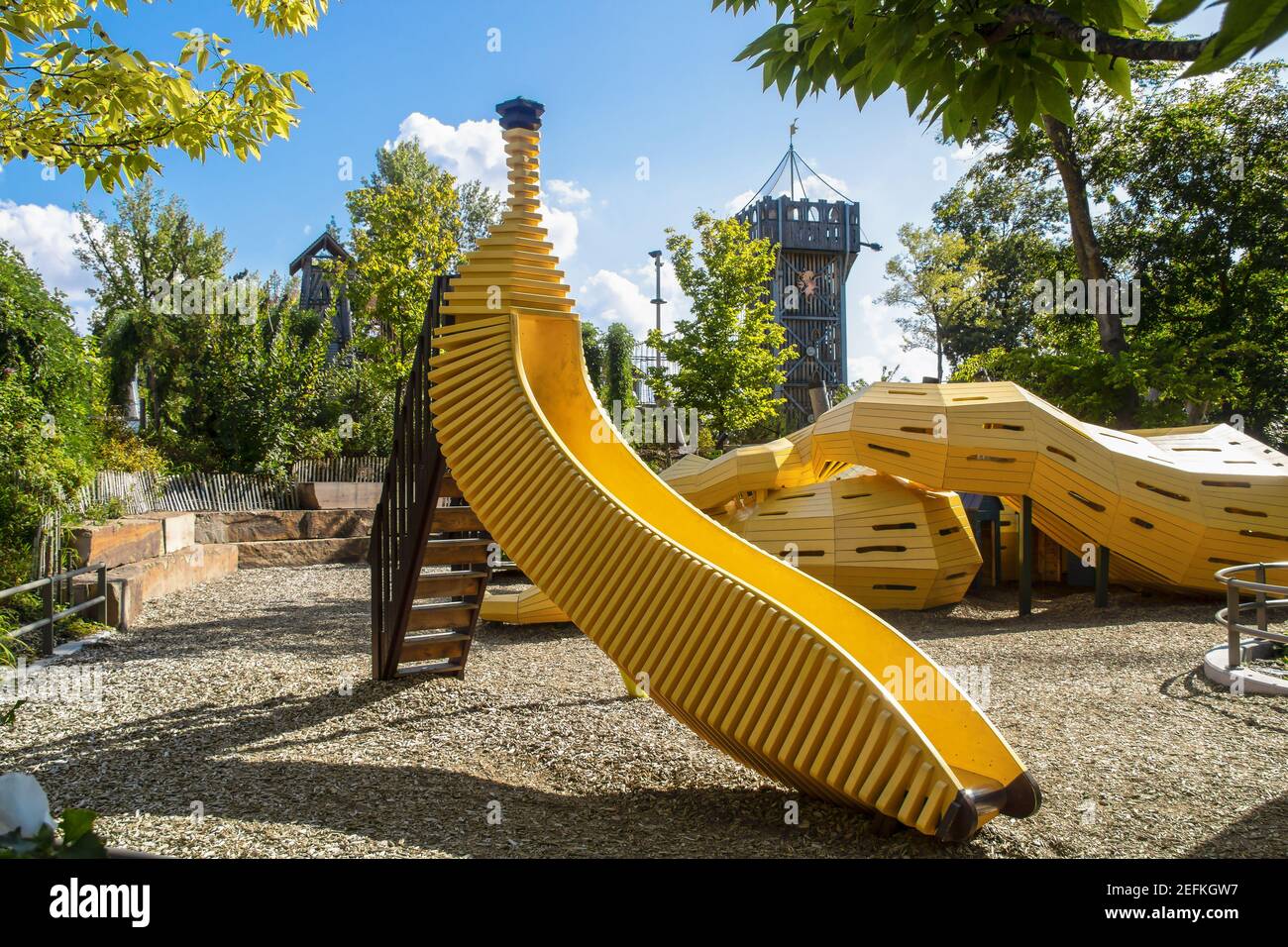 8-18 - 2019 Tulsa USA - The Gathering Place - Award winning public theme park in Oklahoma - Yellow banana shaped slide and snake climbing tunnel with Stock Photo