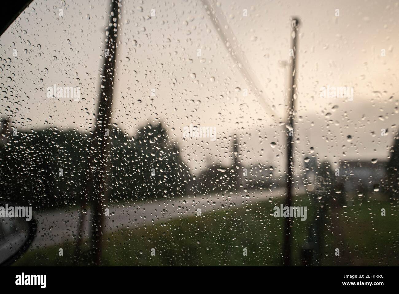 Rain drops falling on the car window Stock Photo Alamy