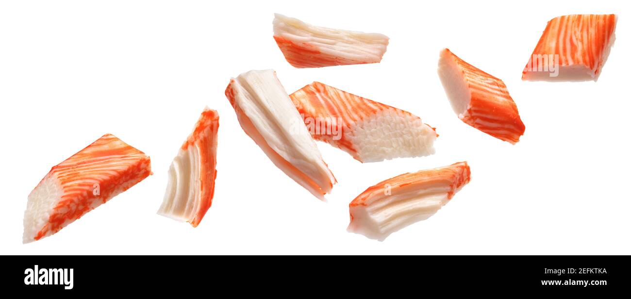 Falling snow crab sticks pieces isolated on white background Stock Photo