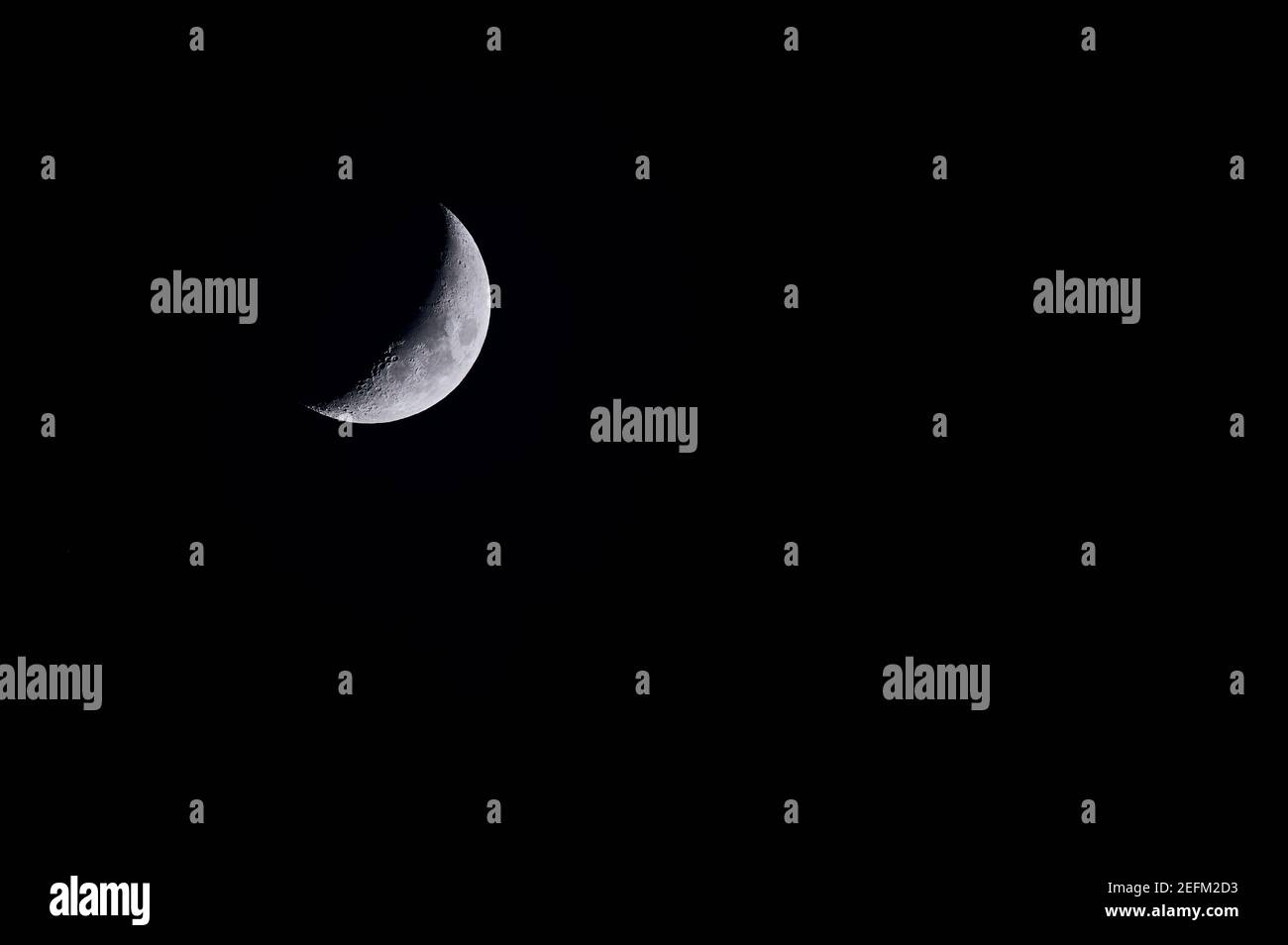 color photo of the waxing moon over Mainz, Germany with copy space for