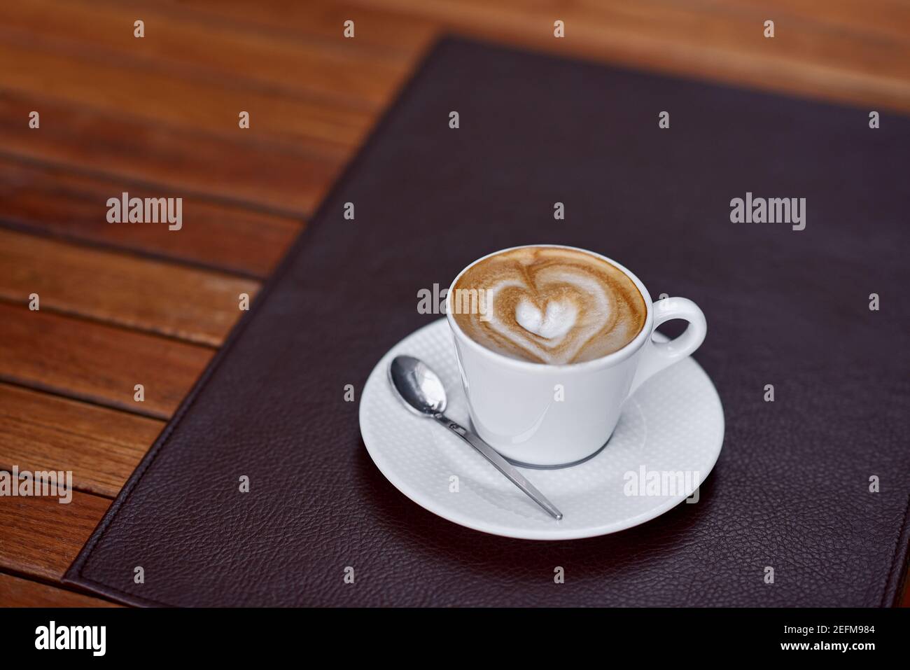 Coffee cup with a heart design Stock Photo
