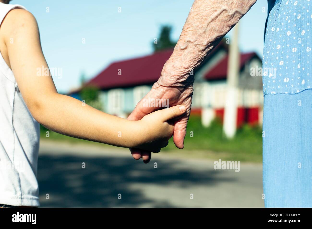 Hands of the old woman granny and child Stock Photo - Alamy