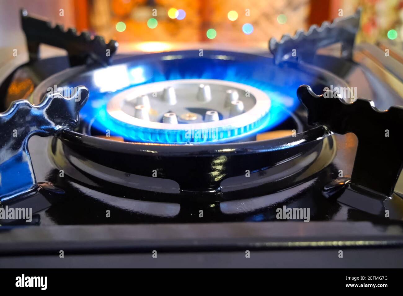 Burning gas stove. Blue flame of a gas burner Stock Photo Alamy
