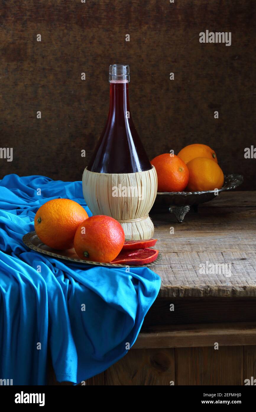 Still life with red wine and citrus Stock Photo - Alamy