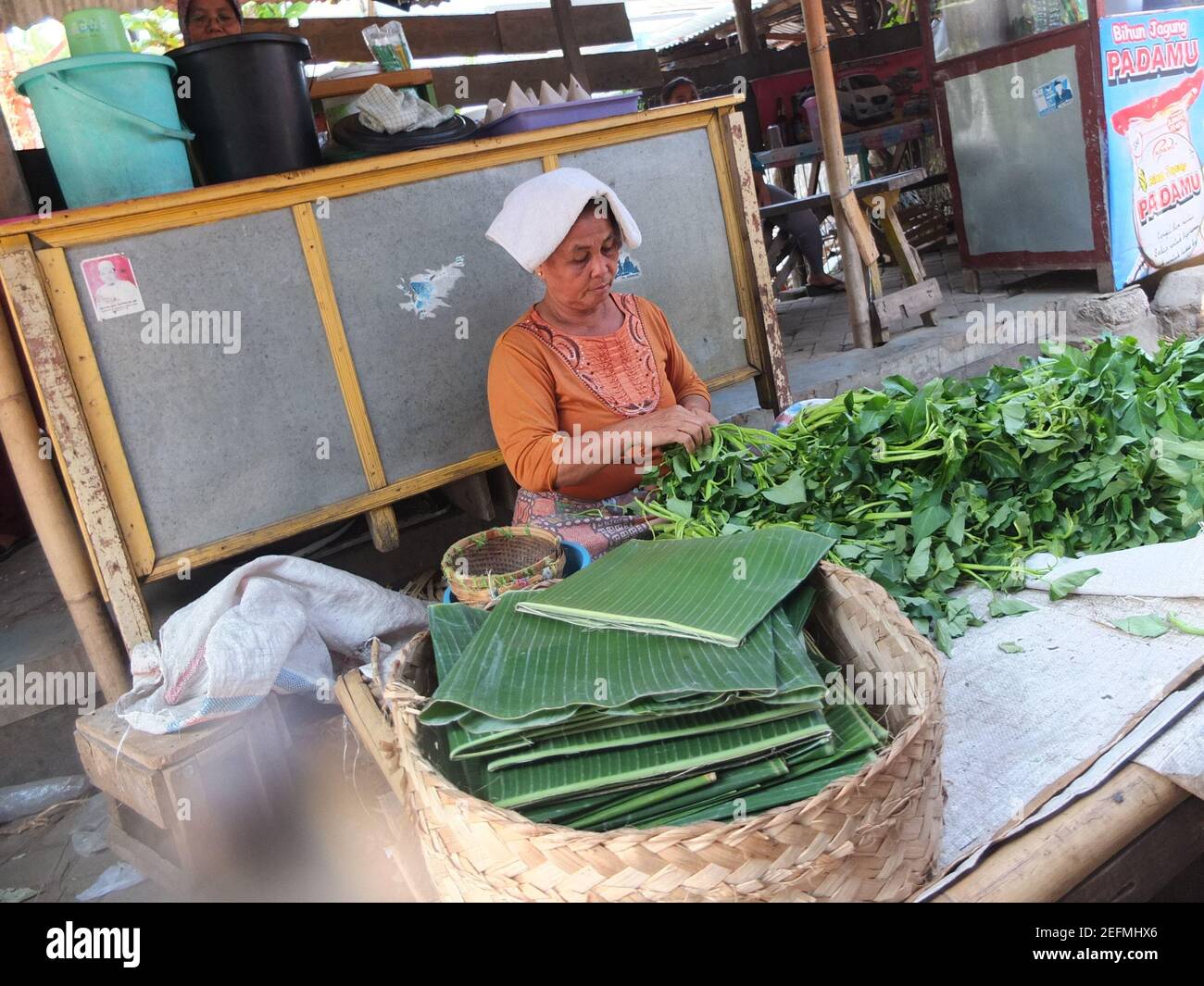 Banana leaves being sold at a market in Bali Stock Photo