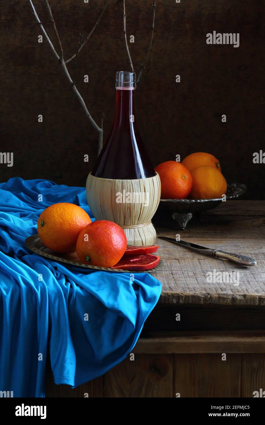Still life with red wine and citrus Stock Photo - Alamy