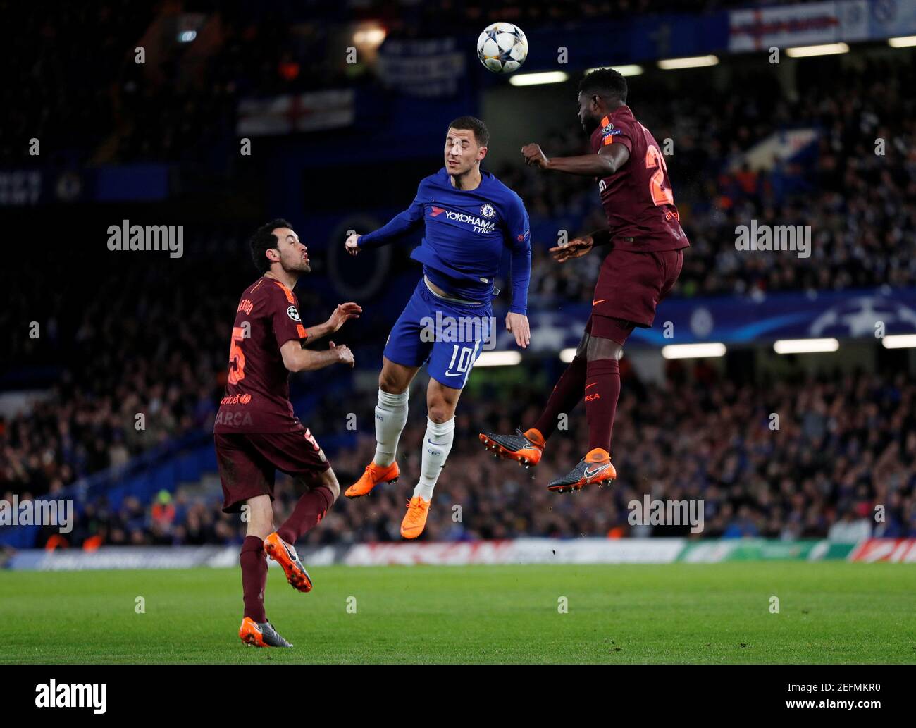 Soccer Football - Champions League Round of 16 First Leg - Chelsea vs FC Barcelona - Stamford Bridge, London, Britain - February 20, 2018   Chelsea's Eden Hazard in action with Barcelona’s Samuel Umtiti and Sergio Busquets    REUTERS/Eddie Keogh Stock Photo