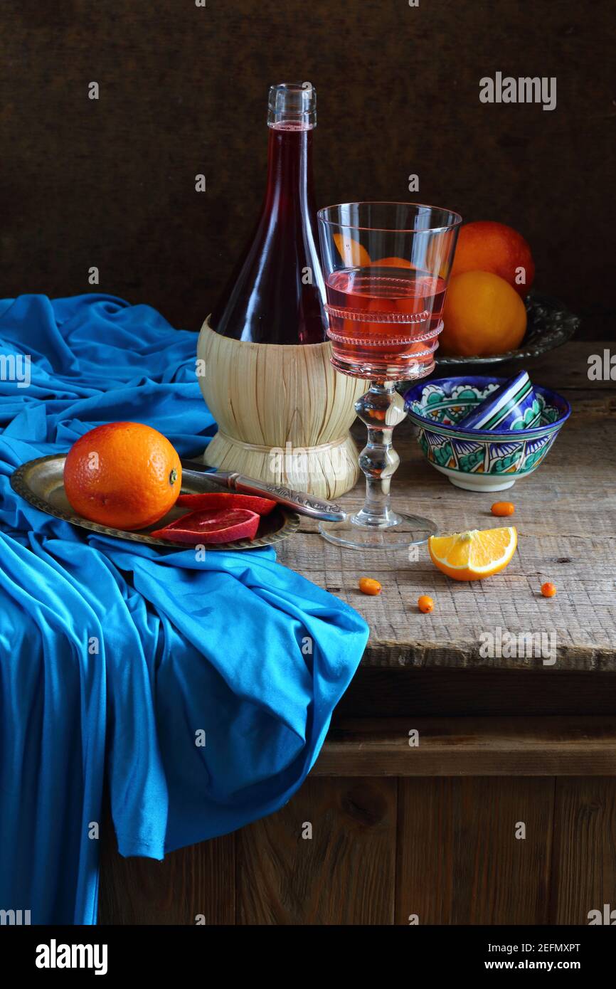 Still life with red wine and citrus Stock Photo - Alamy