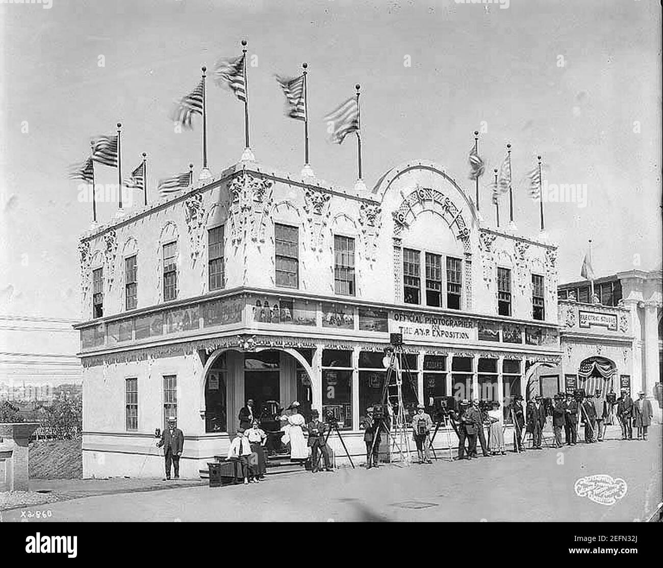 Official Photographer's Building exterior, showing photographers posing with their equipment, Alaska Yukon Pacific Exposition (AYP 338). Stock Photo