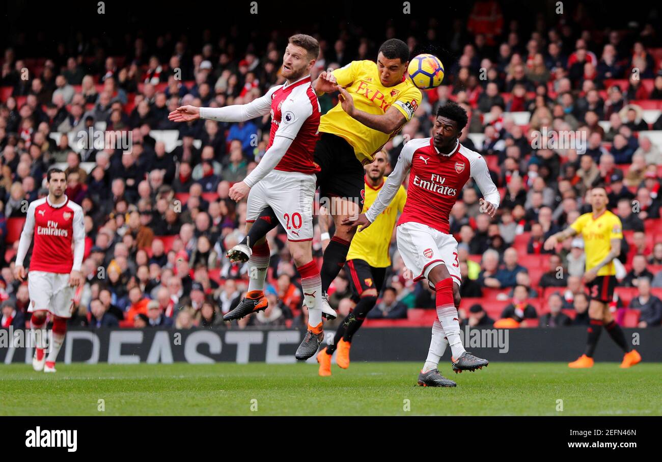 Soccer Football - Premier League - Arsenal vs Watford - Emirates Stadium, London, Britain - March 11, 2018   Arsenal's Shkodran Mustafi in action with Watford's Troy Deeney     REUTERS/Eddie Keogh    EDITORIAL USE ONLY. No use with unauthorized audio, video, data, fixture lists, club/league logos or "live" services. Online in-match use limited to 75 images, no video emulation. No use in betting, games or single club/league/player publications.  Please contact your account representative for further details. Stock Photo